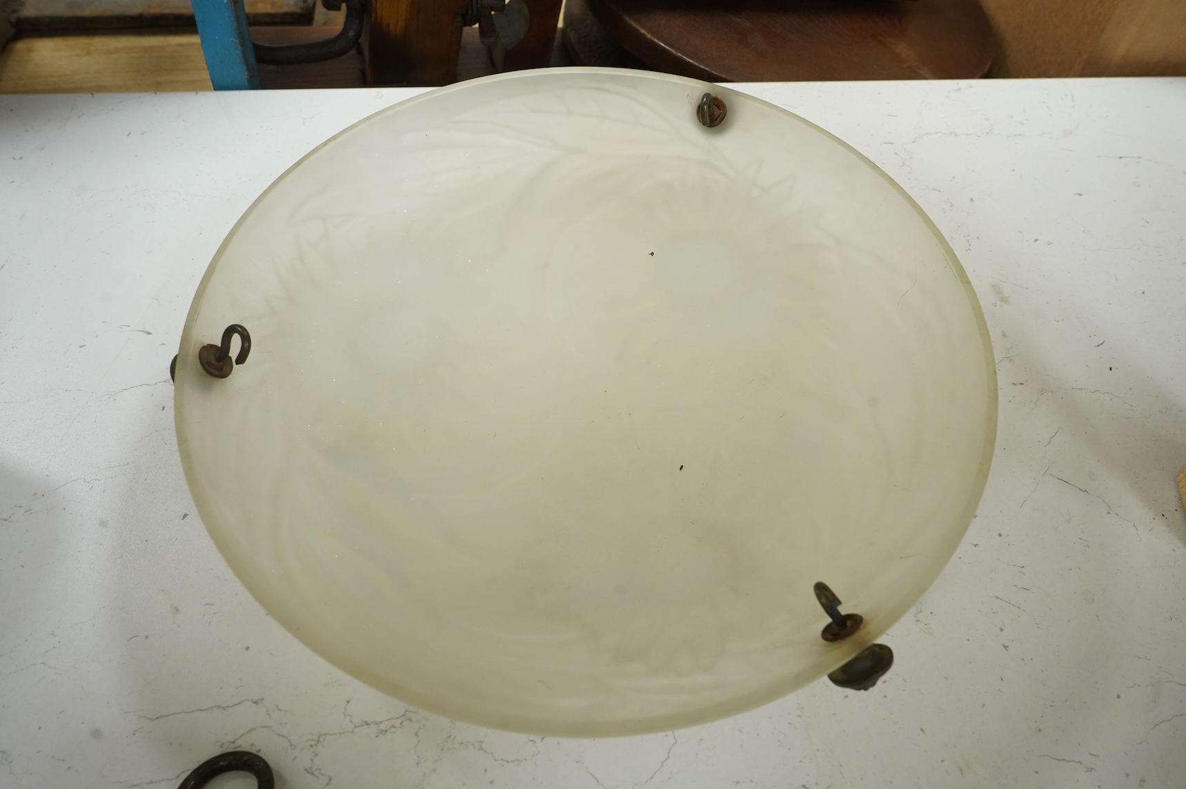 A Lalique style opalescent glass ceiling shade decorated with three sunflowers, 34cm in diameter